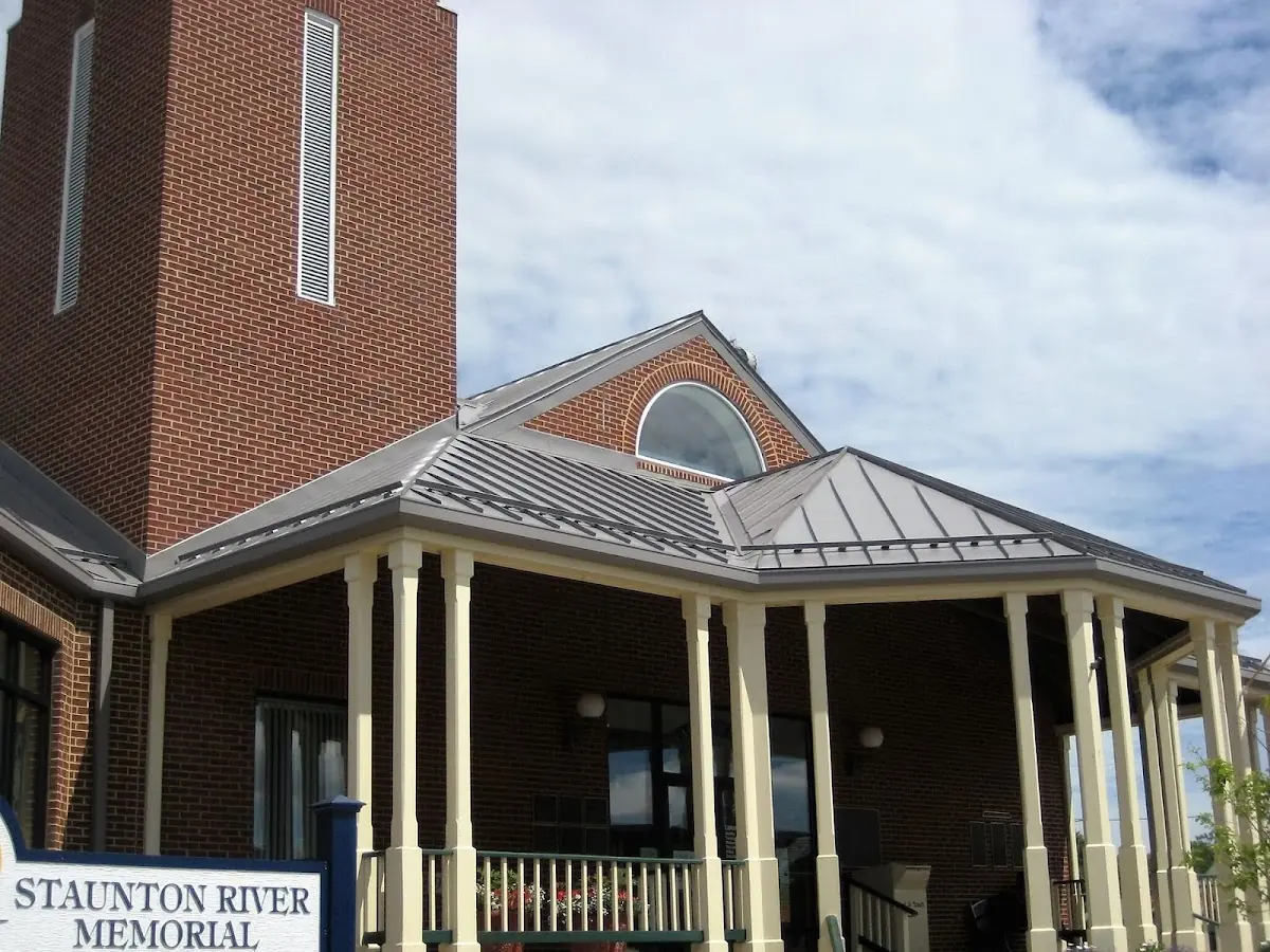 Skilled roofing craftsmen working on a residential roof in Wakefield
